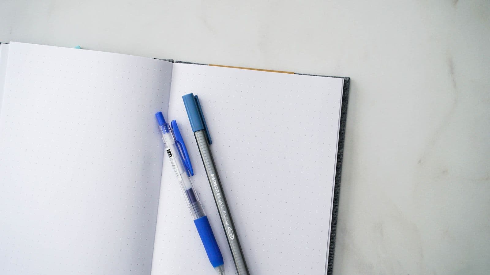 A notebook with a pen and a notebook on it, illustrating 5 Things on Your Credit Report You Can Legally Dispute Right Now.