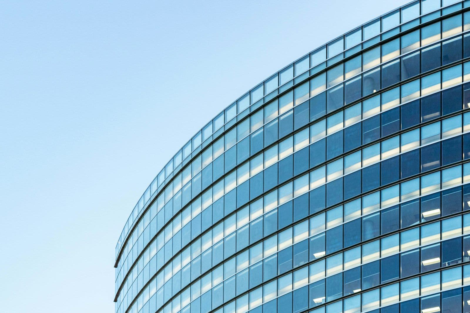White and blue glass walled building, illustrating the 30-Day Rule.