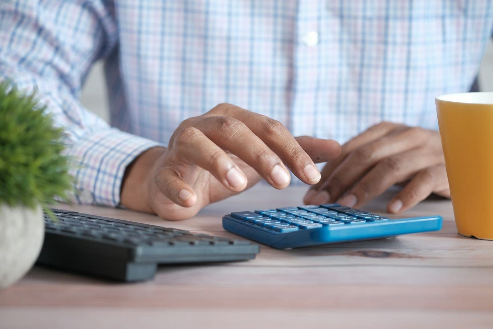 A calculator resting on printed receipts, illustrating the cost of credit repair services.