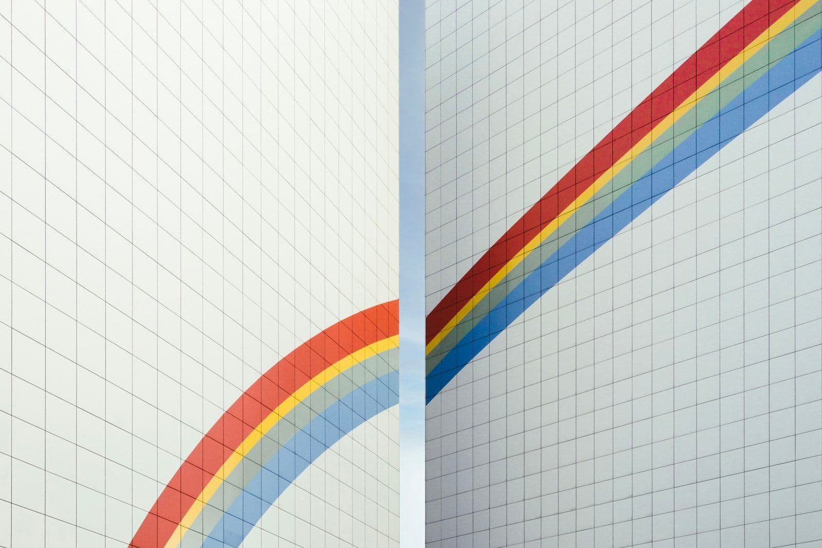 A couple of white walls with a rainbow painted on them, illustrating credit Score Ranges Explained.