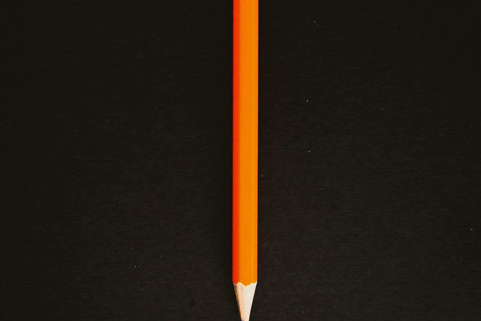 A pencil erasing writing on paper, illustrating correcting personal information on a credit report.