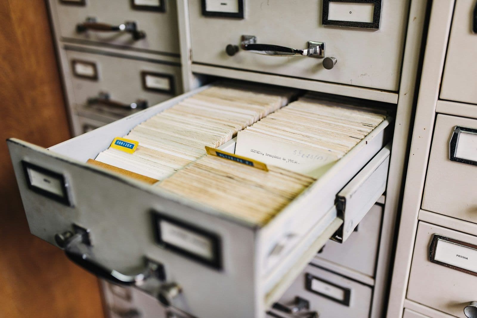 Files stored in an open filing cabinet, illustrating a Section 609 credit file disclosure request.