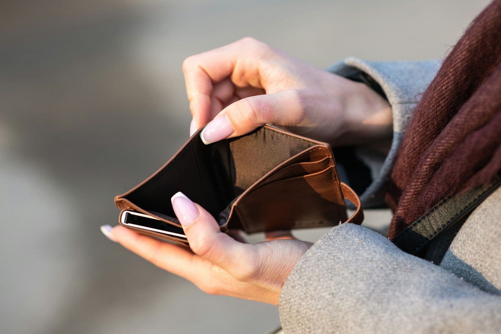 Open empty wallet, illustrating an overdrawn checking account and where overdraft damage actually lands.