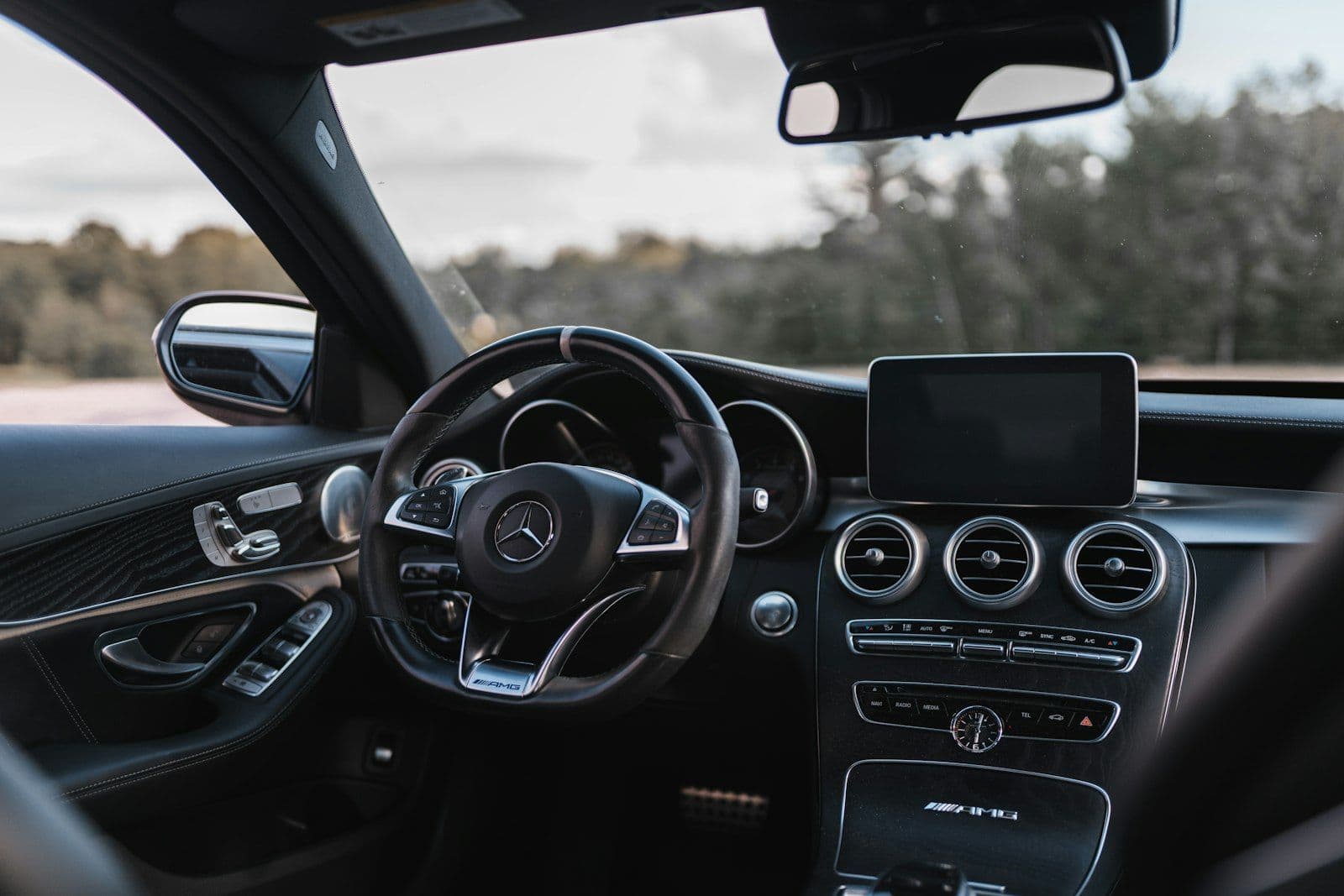 Black mercedes benz car interior, illustrating how to Remove a Repossession from a Credit Report.