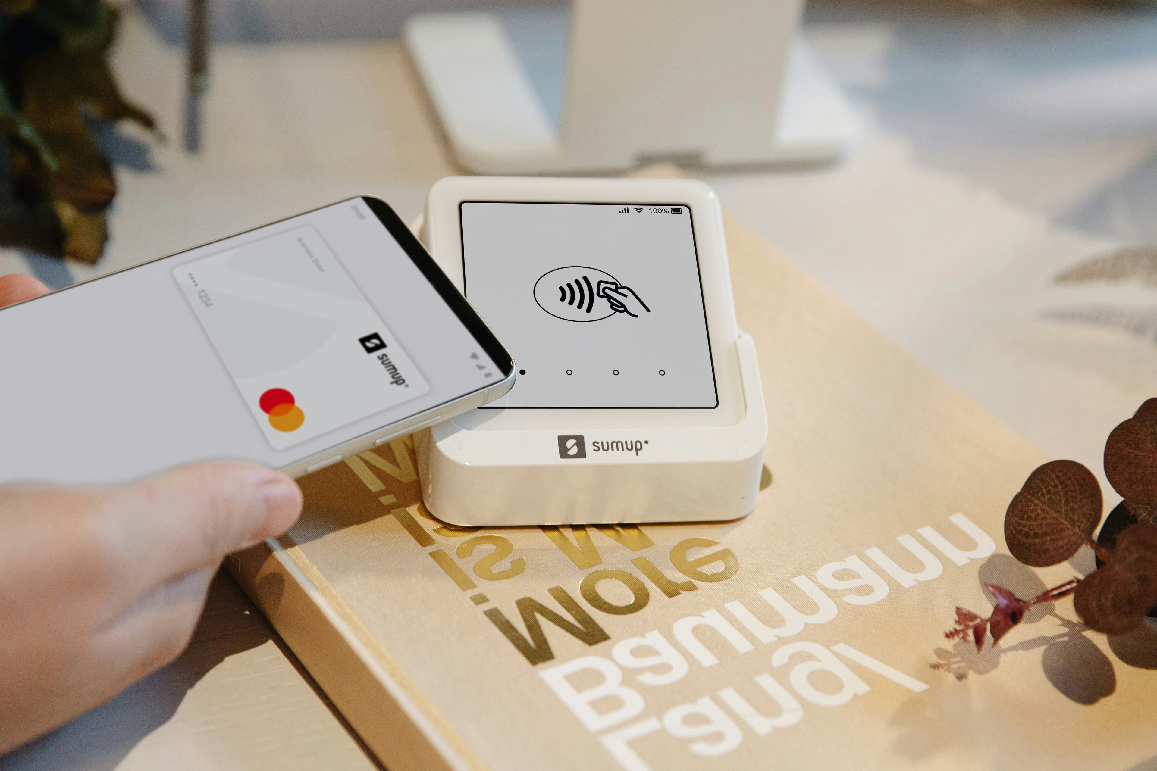 Customer making a contactless payment with a smartphone