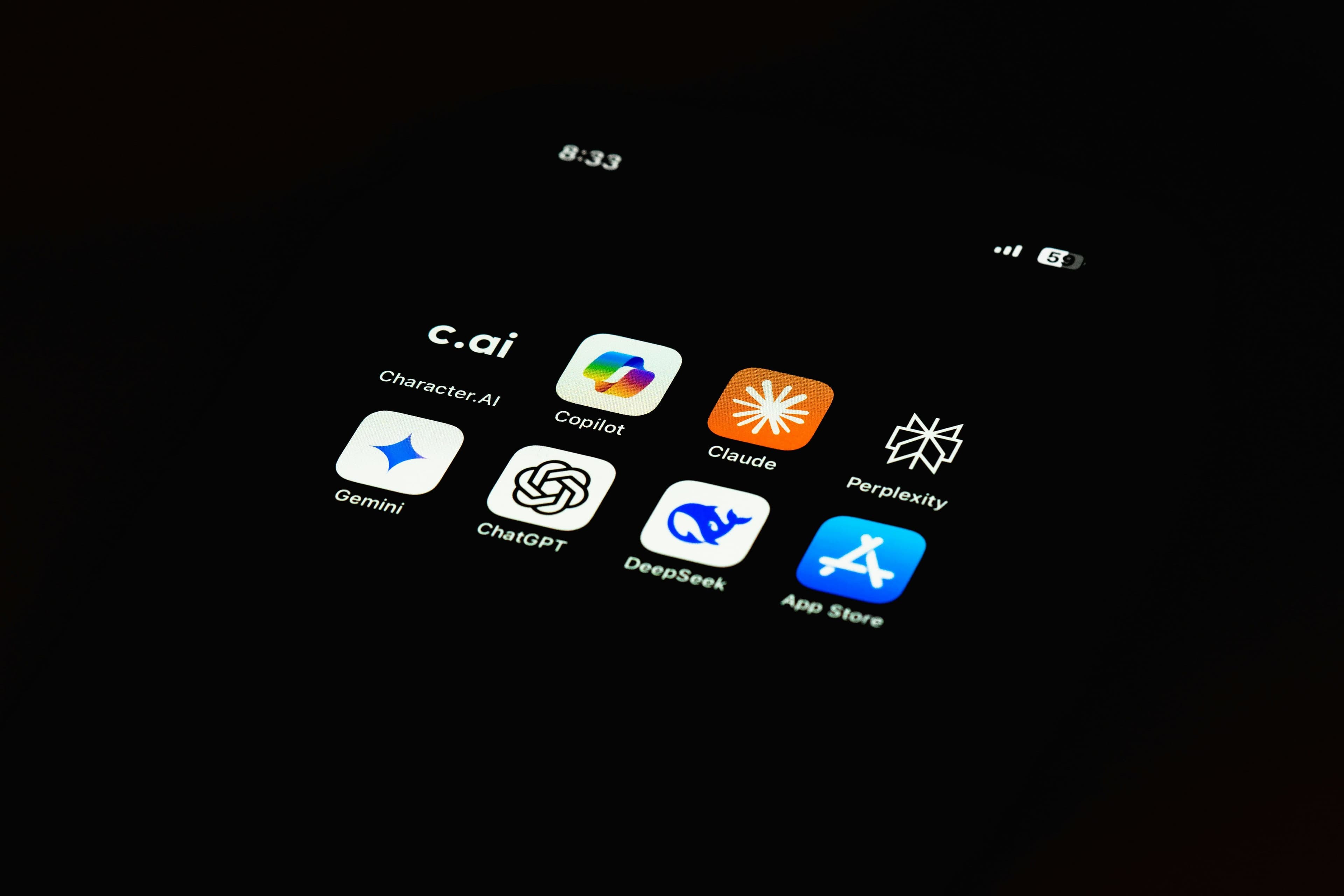 Phone screen showing icons for ChatGPT, Claude, Gemini, and other AI apps.