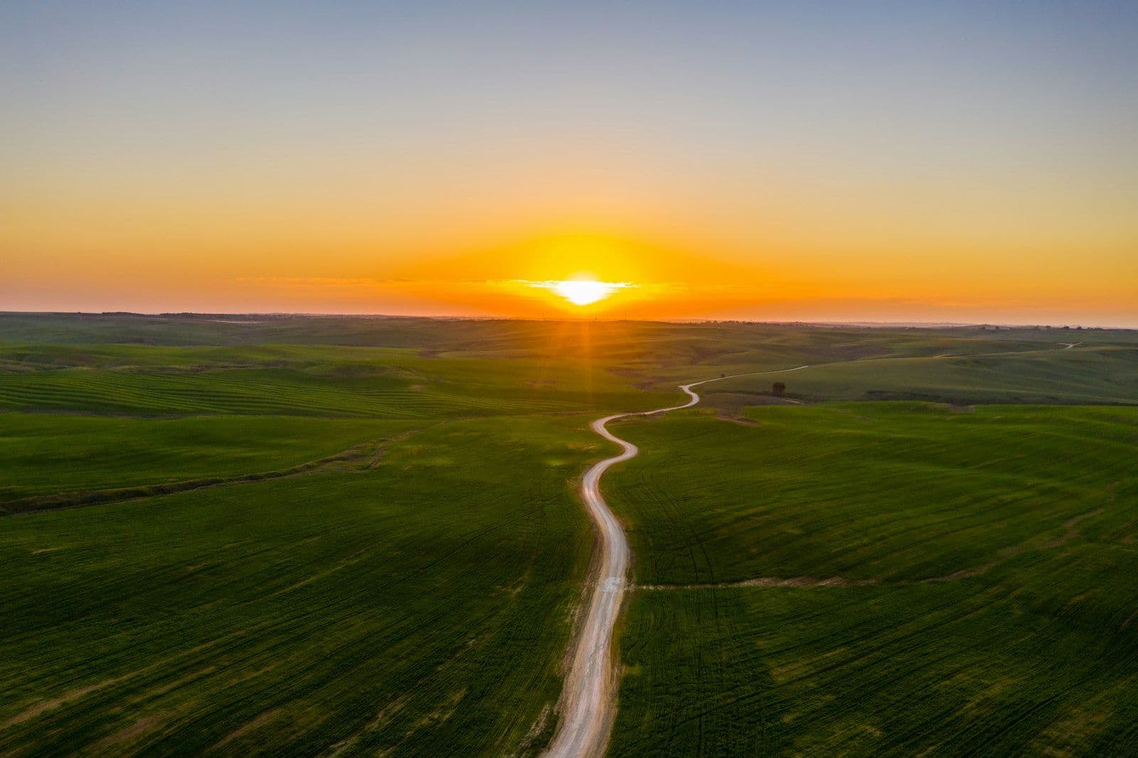 Sunrise over an open road, representing rebuilding credit after bankruptcy.