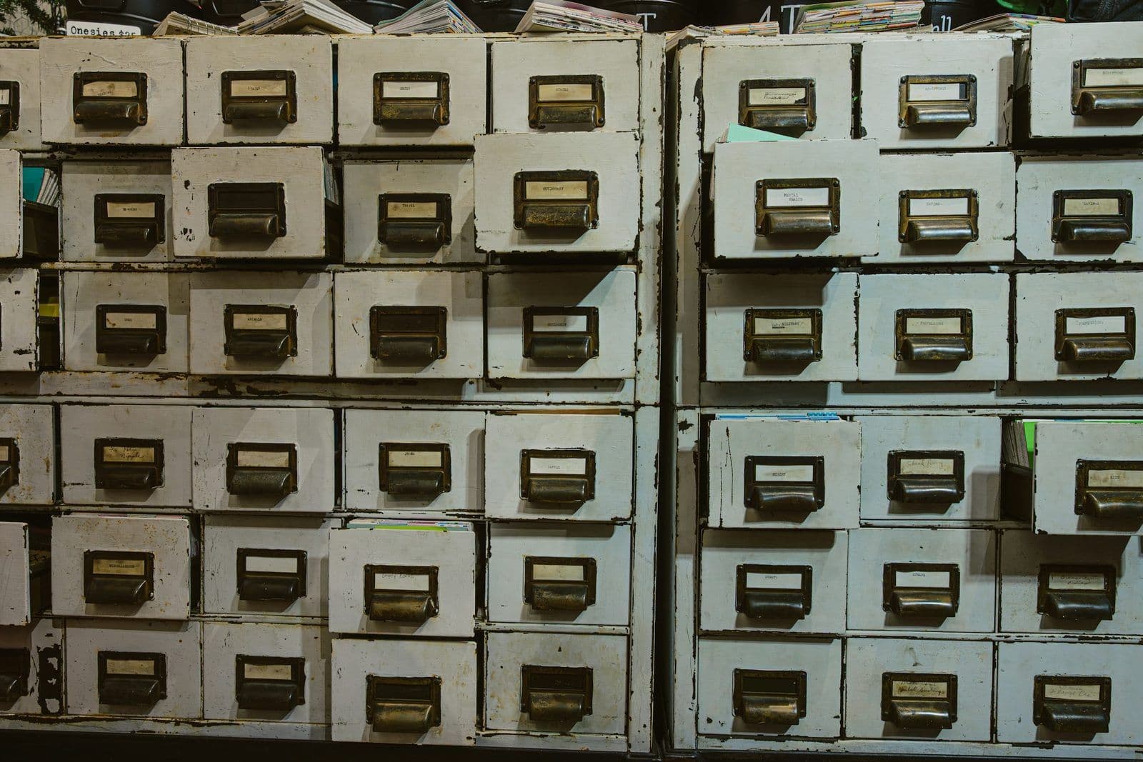 Rows of labeled filing cabinets, illustrating how credit bureaus store consumer records.