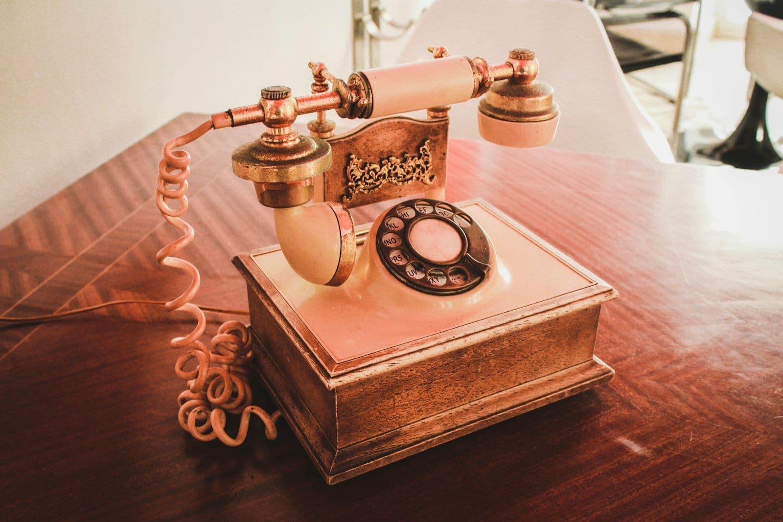 An old telephone on a table, illustrating the strict limits on debt collectors calling family and friends.