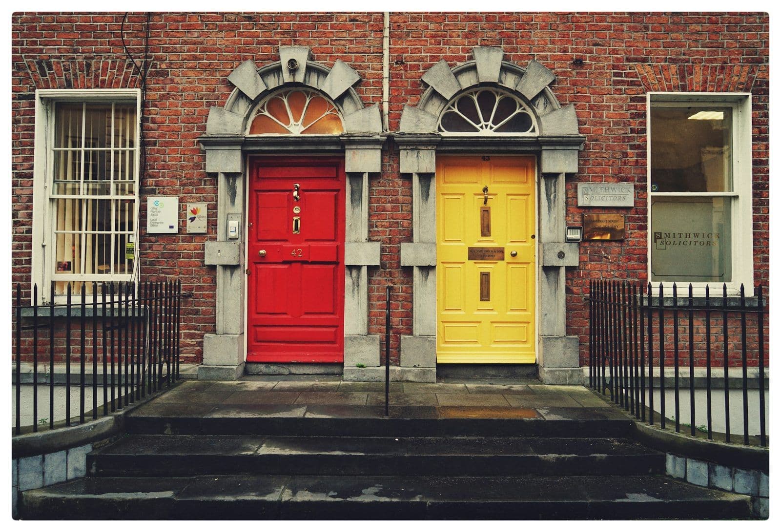Two identical doors side by side, illustrating the same debt appearing twice on a credit report.