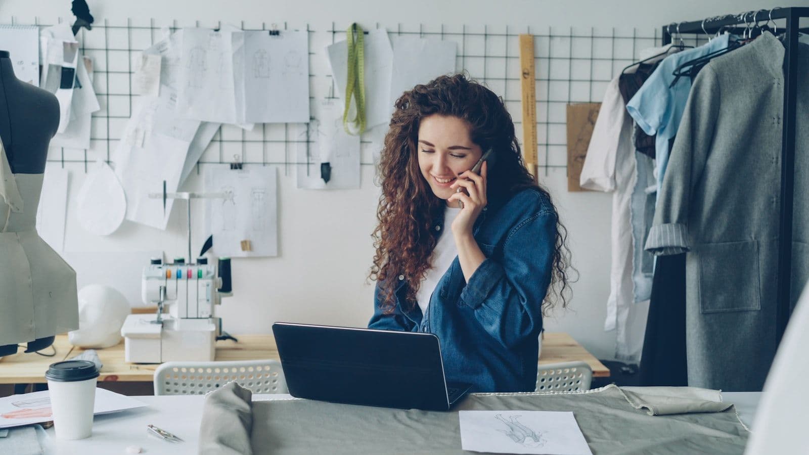 A small business owner working on a laptop, illustrating how to build business credit.