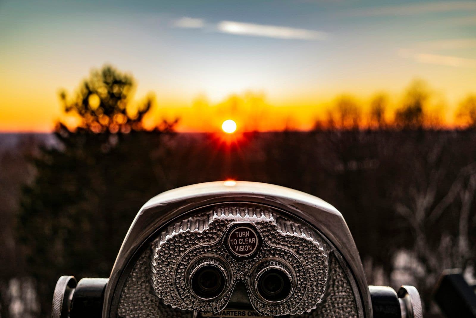 A pair of binoculars trained on the horizon, illustrating how credit monitoring services work.