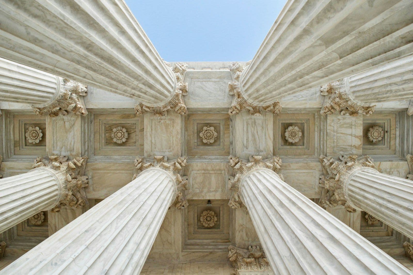 Gray stone columns worm's-eye view photo, illustrating how Long Does Bankruptcy Stay on a Credit Report.