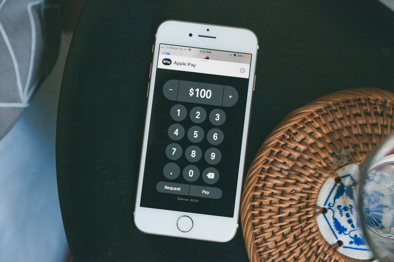 Silver iphone 6 on black table, illustrating wage Garnishment.