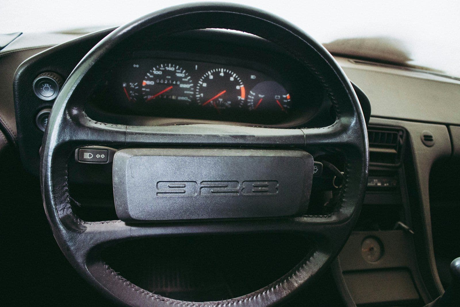 Black 928 steering wheel, illustrating what a 100-Point Score Jump Actually Unlocks.