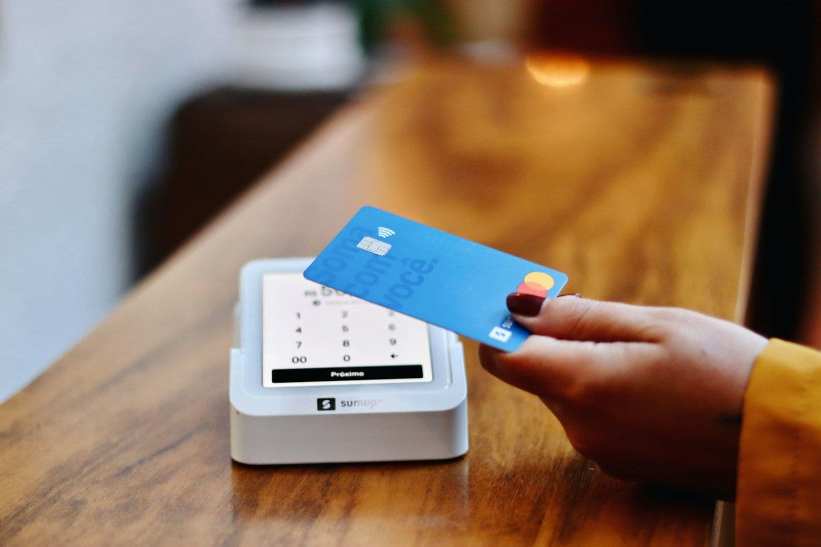 A credit card used at a payment terminal, illustrating going over a credit limit.