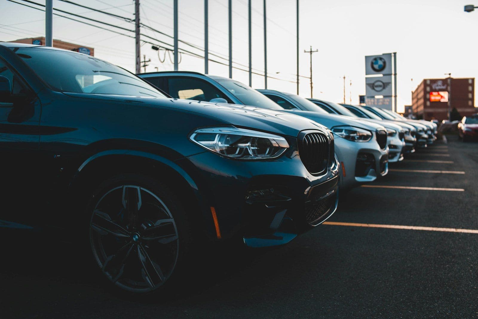 Cars in a dealership showroom, illustrating the credit score needed to buy a car.