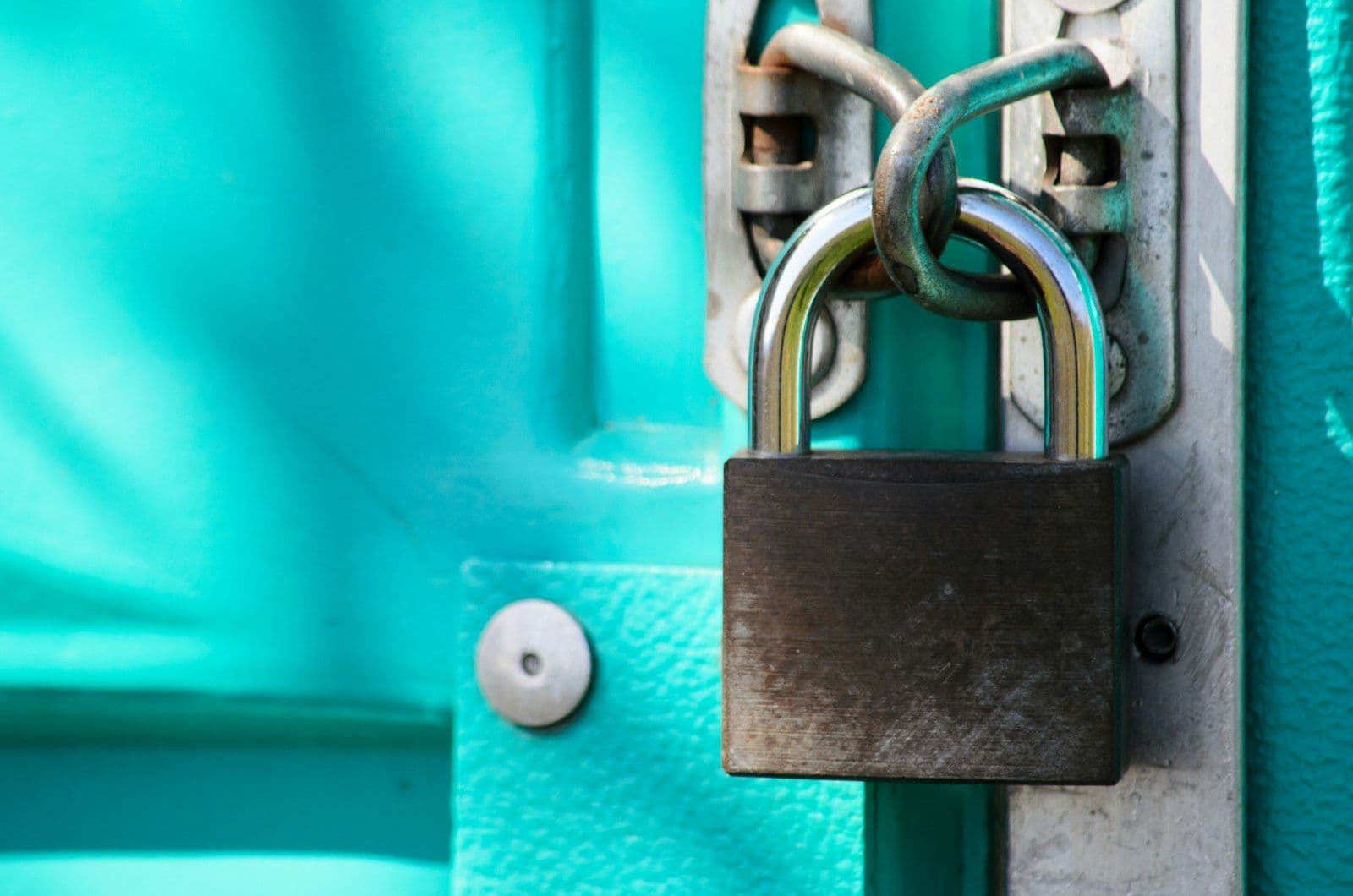 Padlock on a blue background, representing the FCRA Section 605B identity theft block.