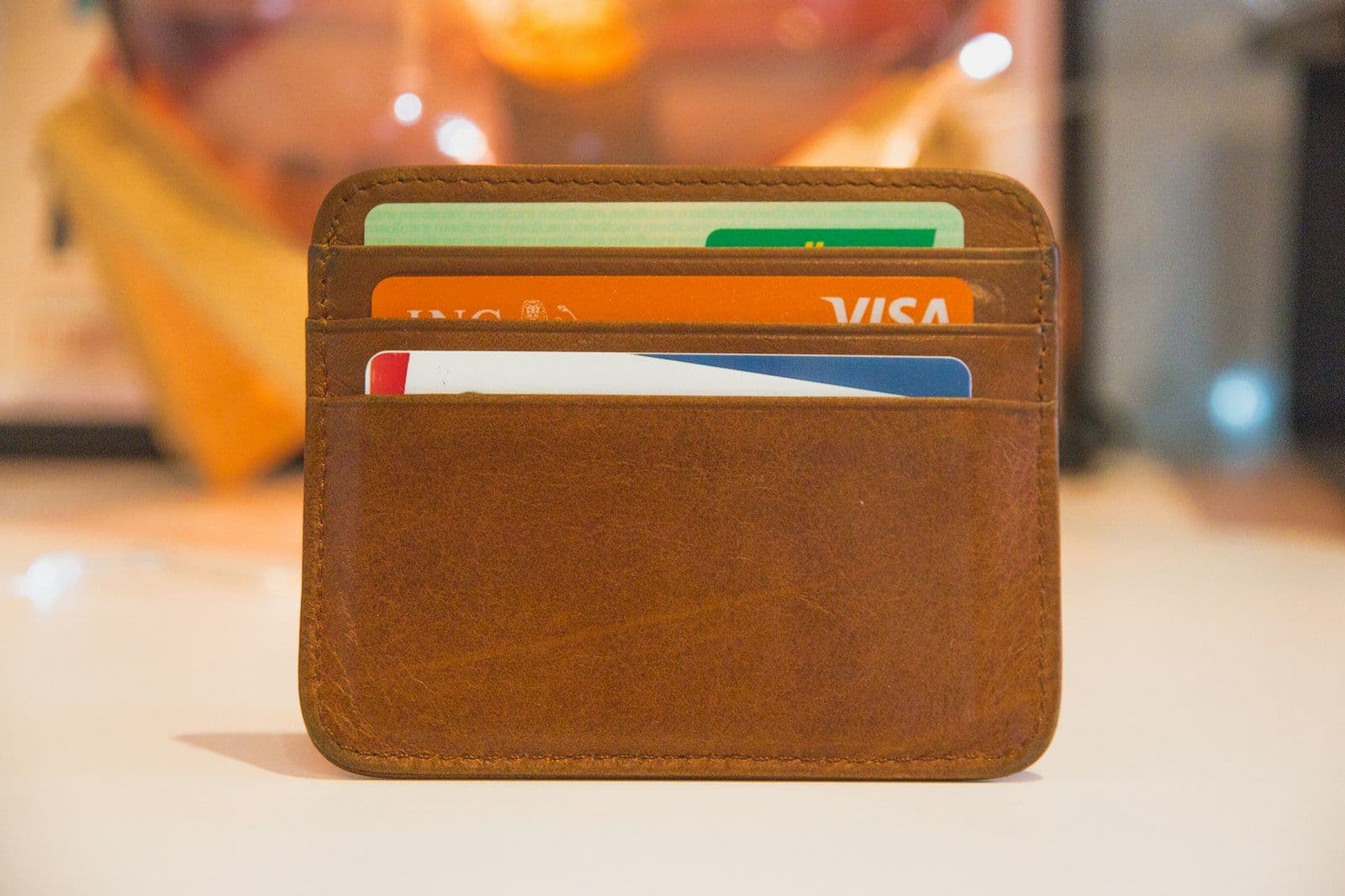 Several credit cards fanned in a stack, illustrating how many credit cards to carry.
