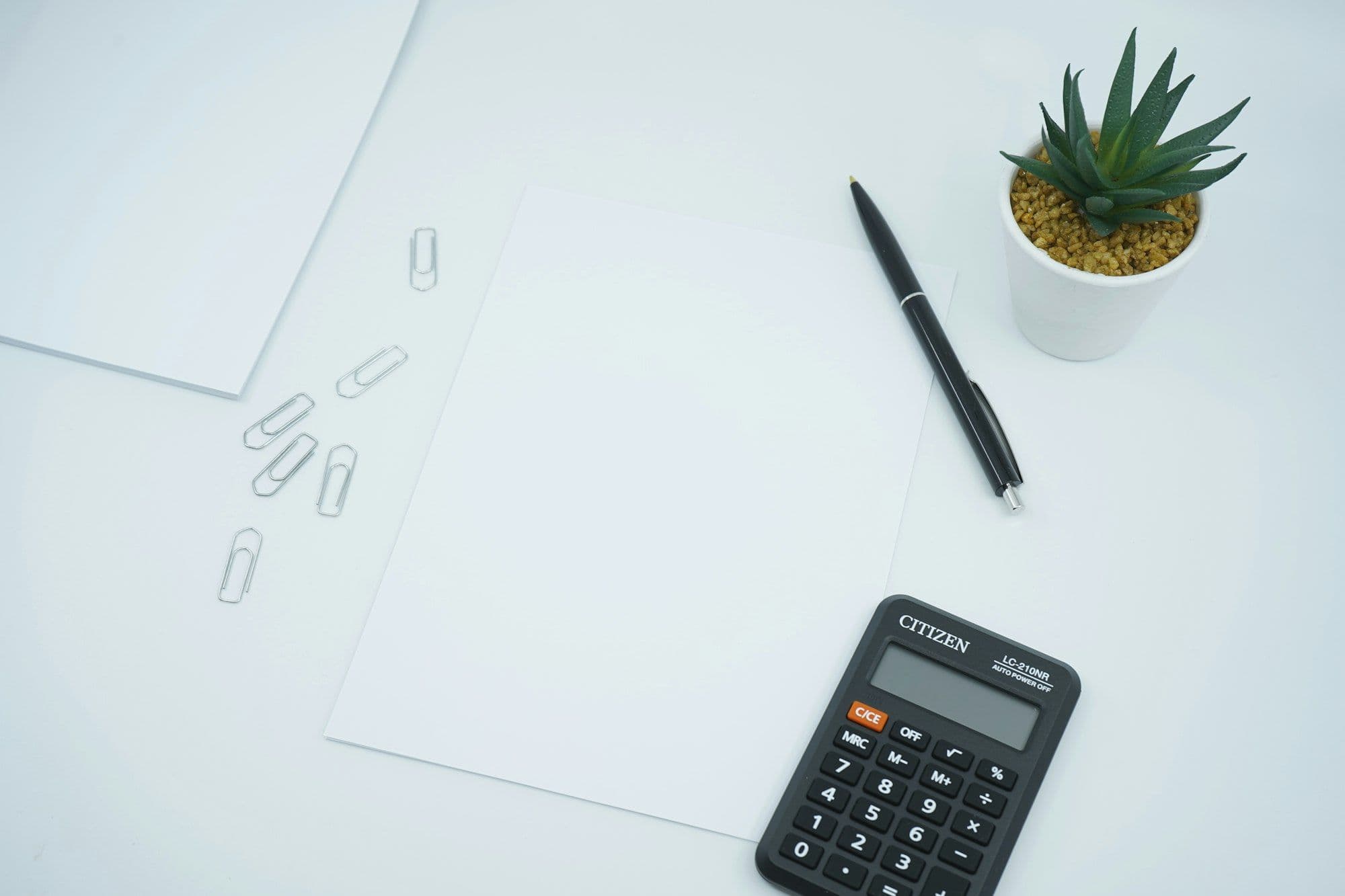 Calculator and pen on a financial statement